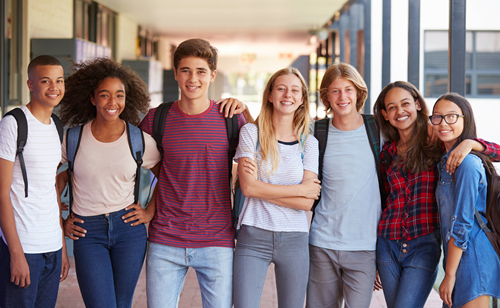 seven high school students standing in a row